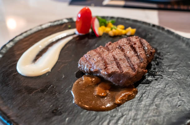 istock Delicious medium rare wagyu beef  steak with gravy sauce. 1215530943