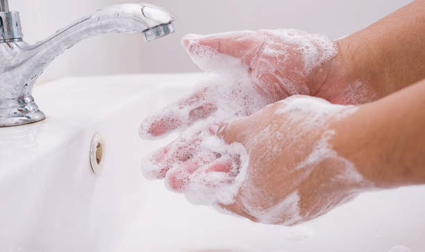 istock washing hands by soap for safety from corona virus 1215532564