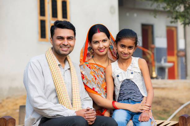 Rural Indian family at village stock photo India, Rural Scene, Village, Father,India, happy indian young family couple stock pictures, royalty-free photos & images