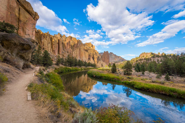 istock River flowing in the valley against the background of sharp rocks. Smith Rock state park, Oregon 1215533355