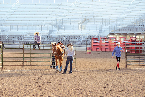 Cowgirls getting ready for a rodeo.