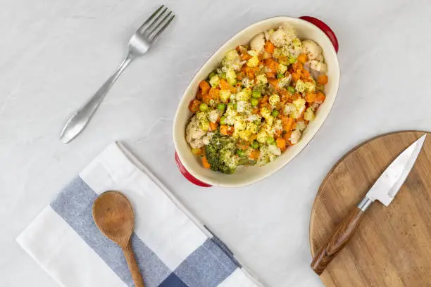 Cooked vegetables salad in the bowl served on the table.