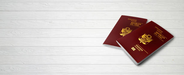istock Peruvian Passports on Wood Lines Background Banner with Copy Space - 3D Illustration 1215535585