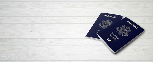 Banner design created with copy space including double passport image on wood background