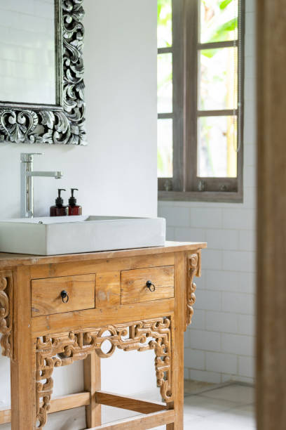 istock White ceramic sink, bottle with  soap and shower gel 1215538358