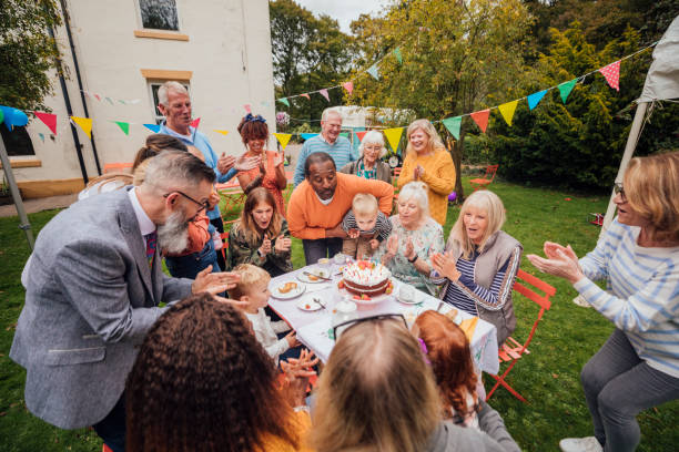 istock Helping Blow Out The Candles 1215538398
