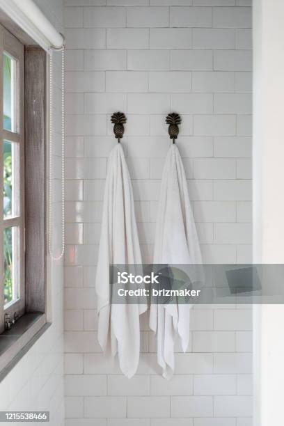 Two Dry Clean And Fresh Towel On Wall Hanger In Bathroom Stock Photo - Download Image Now