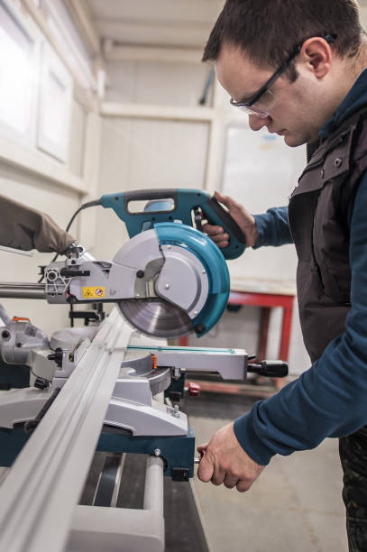 istock Worker technician works with electric wheel grinding on steel structure 1215538538
