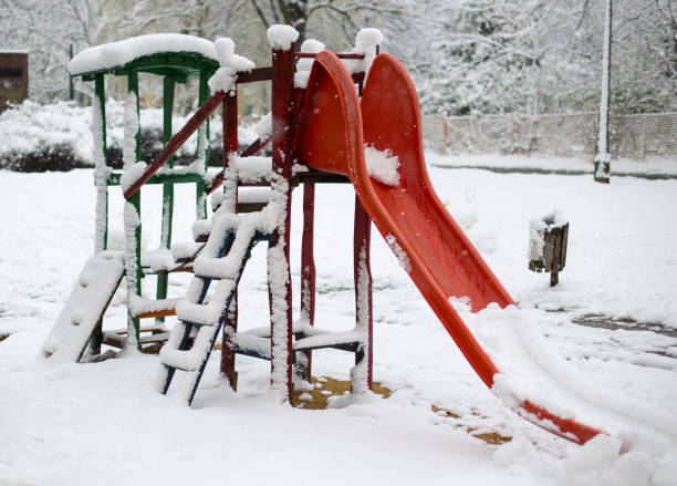 istock Snow covered playground in city 1215540928