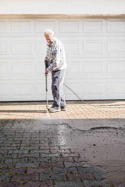 istock Active Senior Man Cleaning the Terrace with High Pressure 1215541481