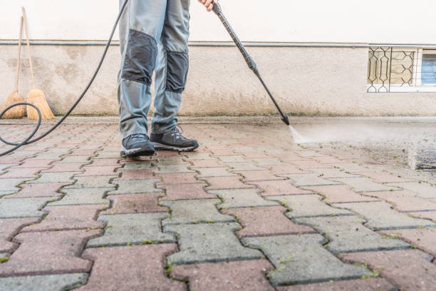 istock Active Senior Man Using High Pressure Washer to Clean the Entrance 1215541502