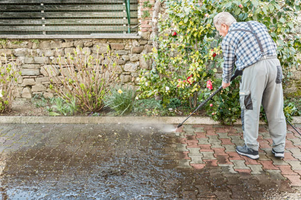 istock Active Senior Man Using High Pressure Washer to Clean the Entrance 1215541509