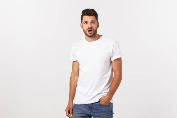 istock Charming handsome. Handsome young man in casual wear while standing isolated on white background 1215542228