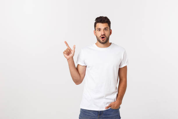 istock Amazed smart man pointing up at copy space over white background. 1215542352