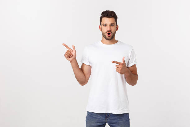 istock Amazed smart man pointing up at copy space over white background. 1215542477