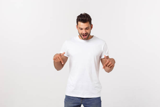 istock Amazed smart man pointing up at copy space over white background. 1215542955