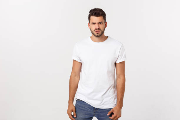istock Charming handsome. Handsome young man in casual wear while standing isolated on white background 1215543899