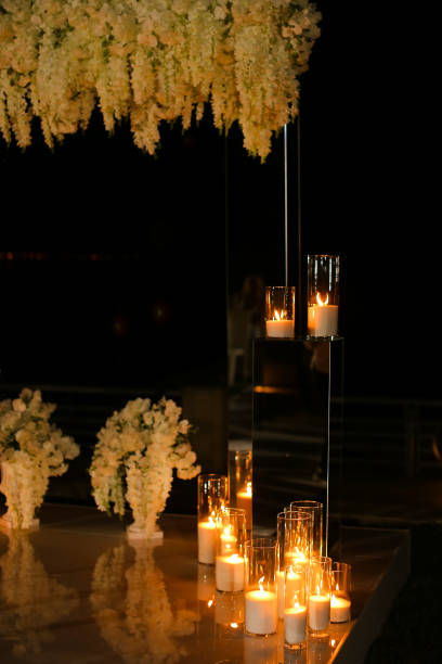 istock Burning candles near wedding altar at night 1215544205