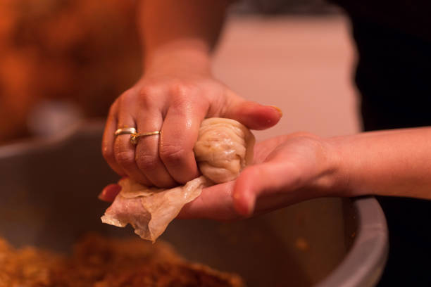 istock Woman is rolling cabbage and making traditional Serbian Sarma 1215544329