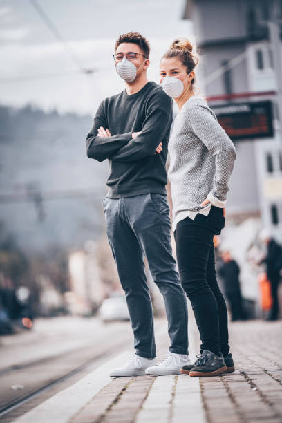 istock Young couple wait for train to arrive in ghost town 1215544466
