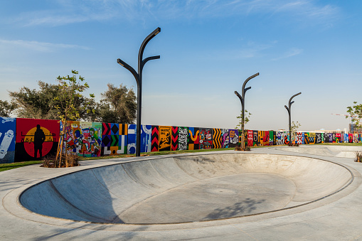 Newly made skate park one meter depth with the colorful wall at the back