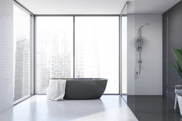 istock White tile and gray bathroom with tub and shower 1215545127