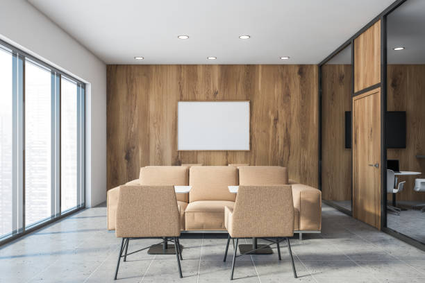 istock White and wooden office lounge with poster 1215545793