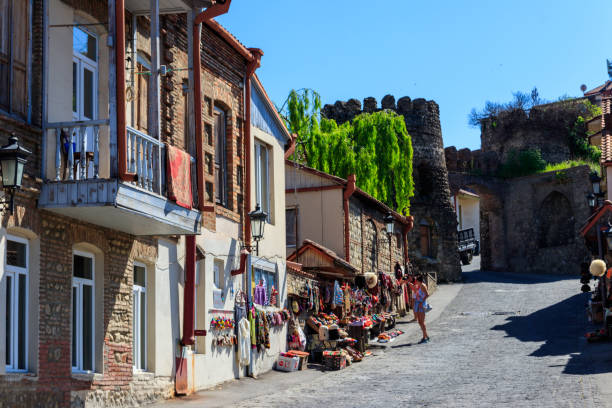 Street in medieval town Sighnaghi Sighnaghi, Kakheti, Georgia - May 2, 2018: Street in medieval town Sighnaghi. Sighnaghi or Signagi is a heart of Georgia's wine-growing regions. Also known as city of Love kakheti georgia stock pictures, royalty-free photos & images