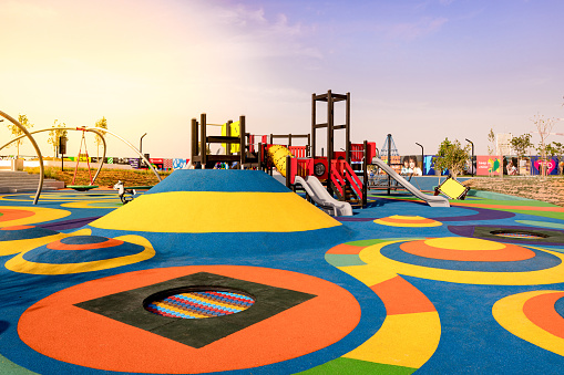 Colorful rubber mounds with the trampolines and activity tower in the middle