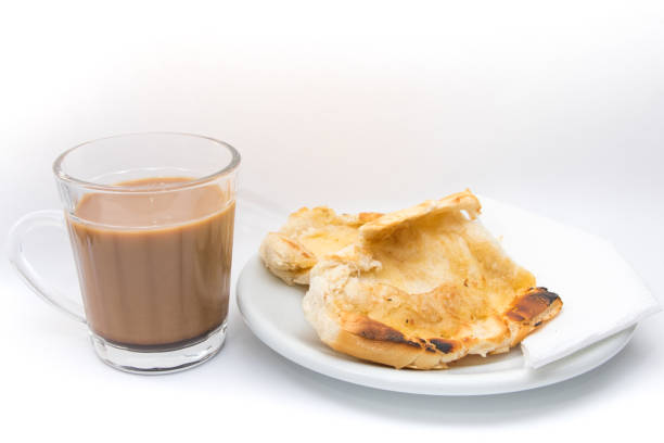 Pao na Chapa. Popular brazilian bread with melted butter Popular brazilian bread with melted butter called pao na chapa. Pao na chapa traditional brazilian breakfast. Glass of hot coffee with milk called pingado. griddle stock pictures, royalty-free photos & images