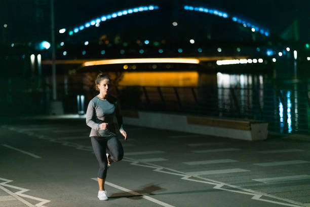 istock Late Night Jogging in the City 1215548624