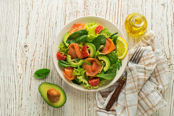 istock Green lettuce salad with smoked salmon and avocado 1215548967