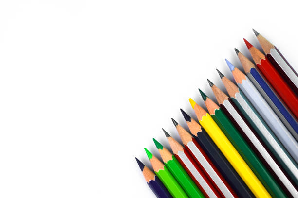 istock Row of some different colored wood pencil crayons before a empty white background 1215549492