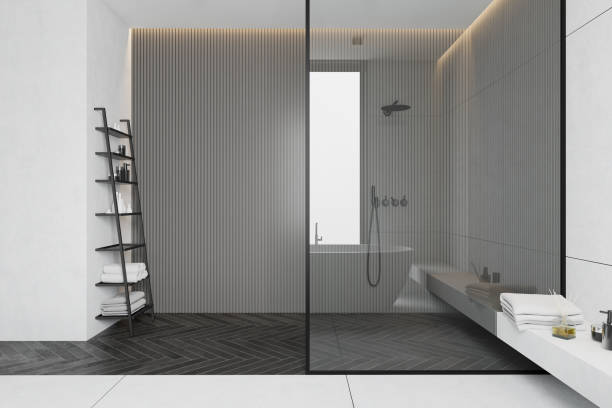 istock Gray and white tile bathroom with shower 1215550925