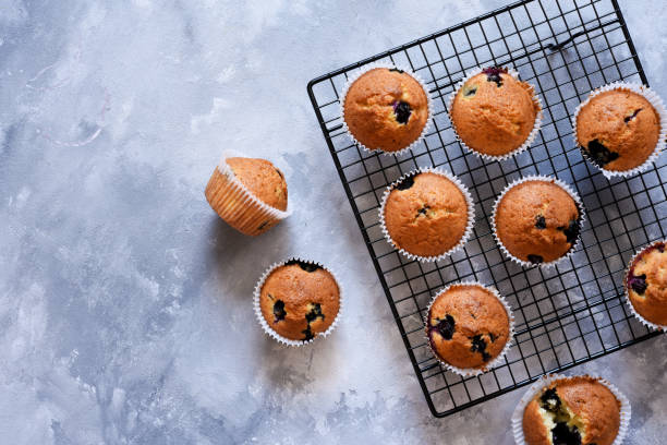 istock Vanilla muffins with blueberries on a concrete background. View from above. 1215551707