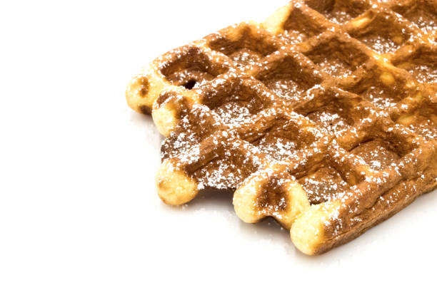 istock Freshly baked Belgian waffles, close-up. Dessert 1215551909