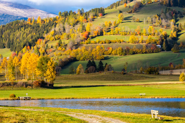 autumn pond under the mountains, Murau district, Styria, Austria