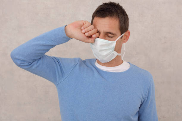 istock Man touching is face, eyes. Coronavirus prevention, New habits, Self-isolation , Quarantine 1215552467