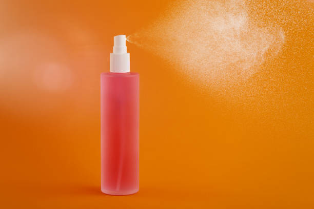istock Bottle of pink perfume or sanitizer spraying 1215552572