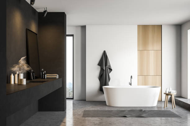 istock Black and white bathroom with tub and sink 1215554003