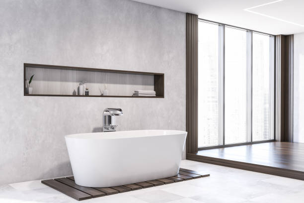 istock White bathroom corner with tub and shelf 1215554044