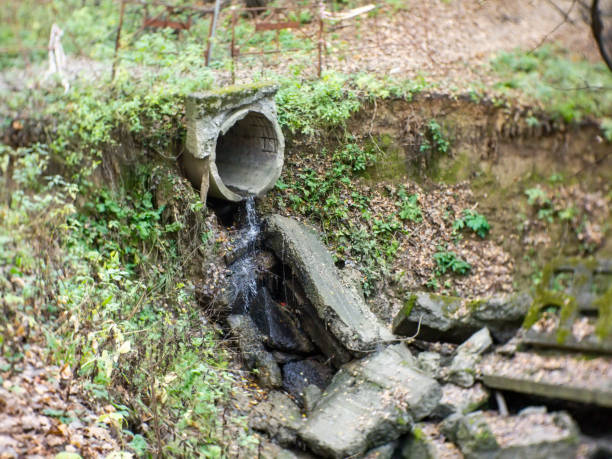 istock a stream flows out of a pipe in a Park 1215554231