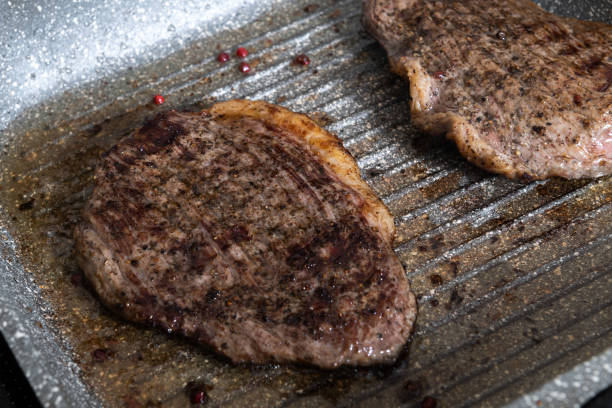 istock Grilled beef steak ribeye on a pan with salt and pepper 1215554608