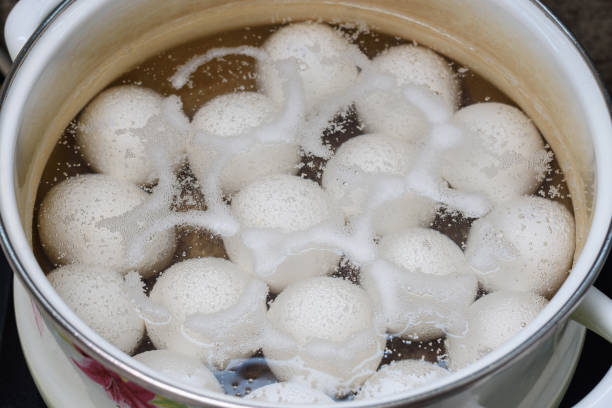 istock Chicken eggs are boiled in a pan, close-up 1215556338