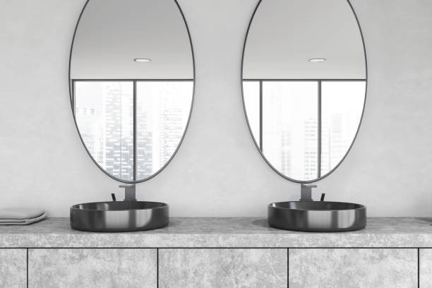 istock Round double sink in white bathroom 1215556675
