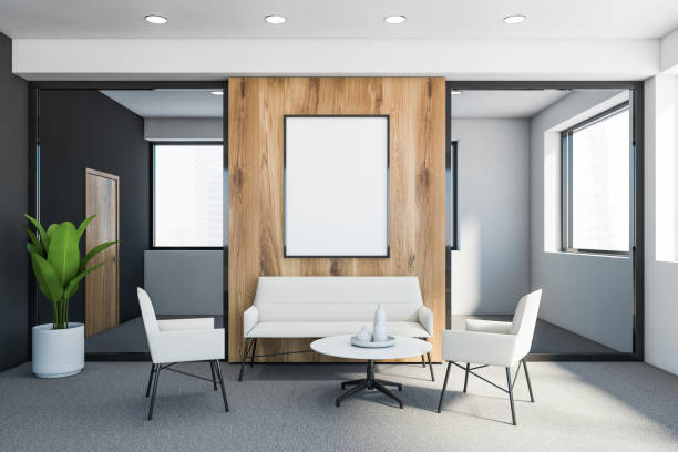 istock Grey and white office waiting room with poster 1215557304