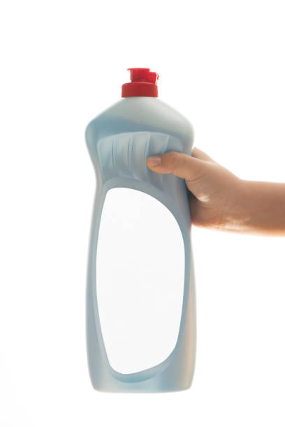 istock Little child hand holding  liquid laundry detergent 1215557651