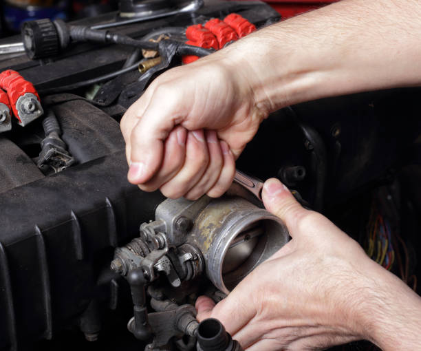 istock Car service - Engine repair mechanic hands with  wrench 1215558690
