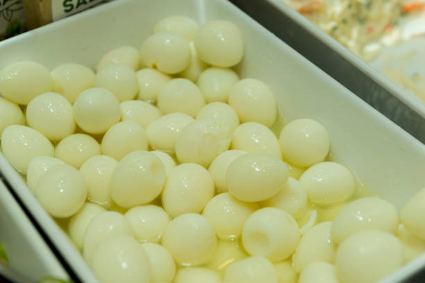 istock Closeup of quail eggs cooked in white ceramic bowl. 1215560311