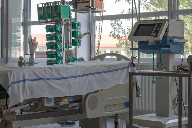 Intensive care unit in hospital, bed with monitor, ventilator, a place where can be  treated patients with pneumonia caused by coronavirus covid 19. stock photo